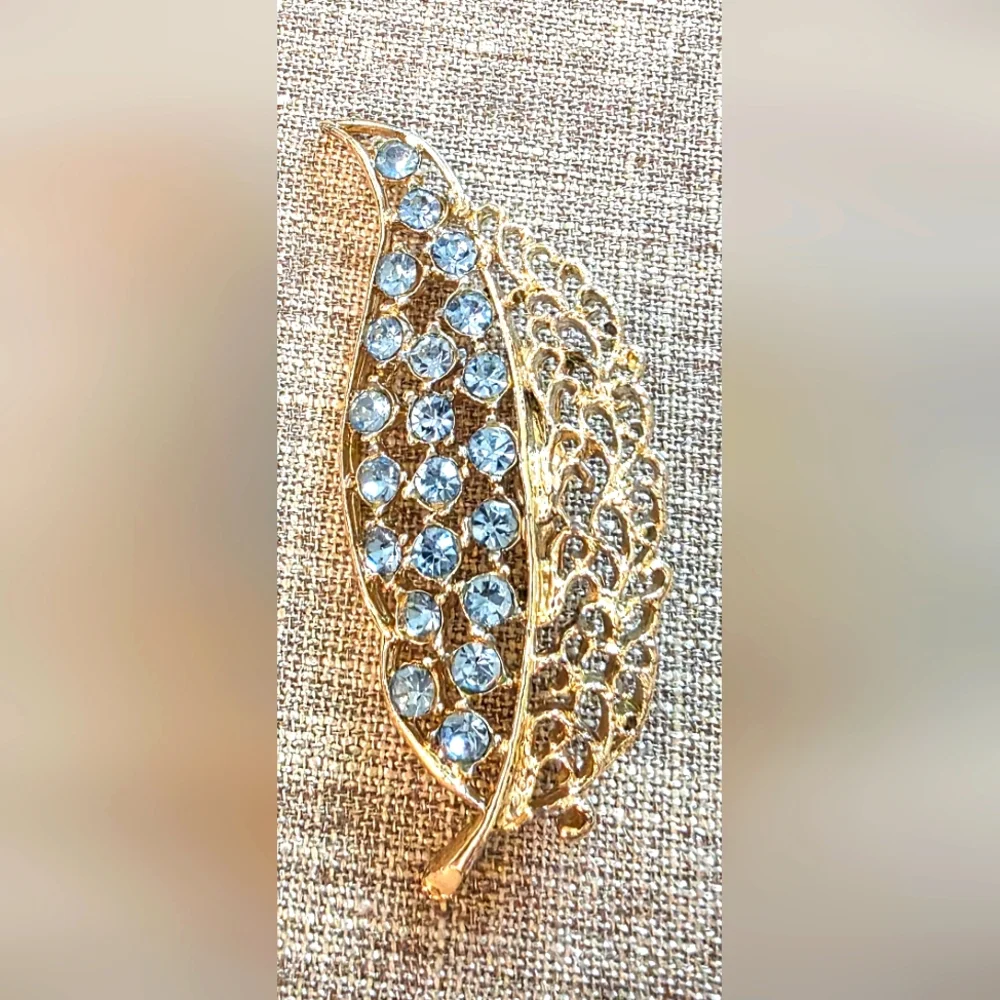 Vintage Gold Leaf Brooch With Light Blue Rhinestones.  Unsigned